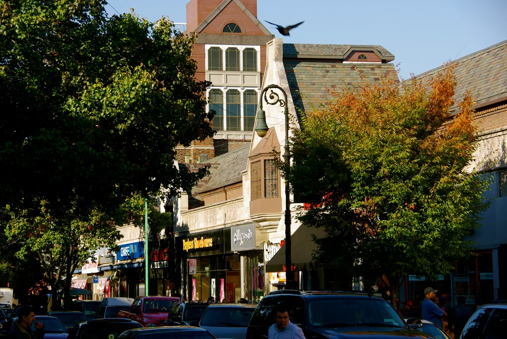 Tree-lined 82nd Street shopping district in Jackson Heights, Queens